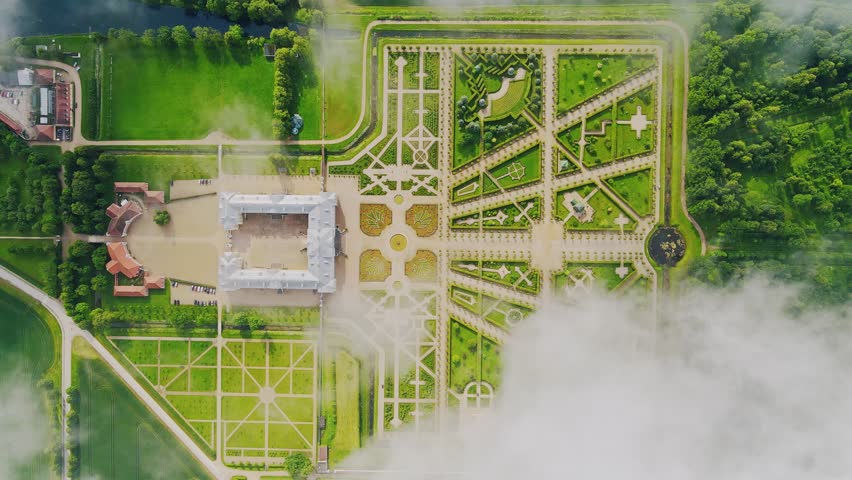 Static top down shot, Latvia’s baroque Rundāle Palace gardens veiled by clouds