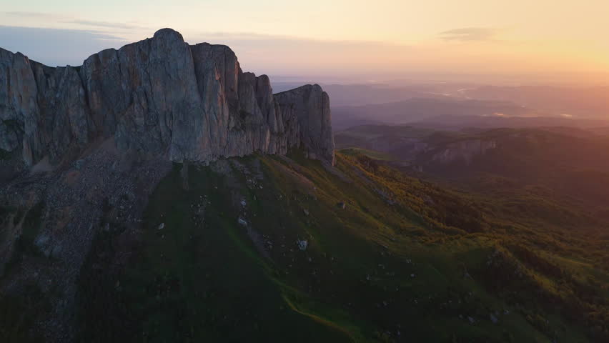 Above view of Bolshoy Tkhach rocky mountain in Caucasus with sunset or sunrise light