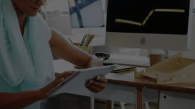 Adult woman tapping tablet, initiating financial graph overlaying monitor and analyzing market data. Financial analysis, data visualization, professional workspace, digital technology, market trends, - Powered by Shutterstock - Get 15% off with code: PIKWIZARD15