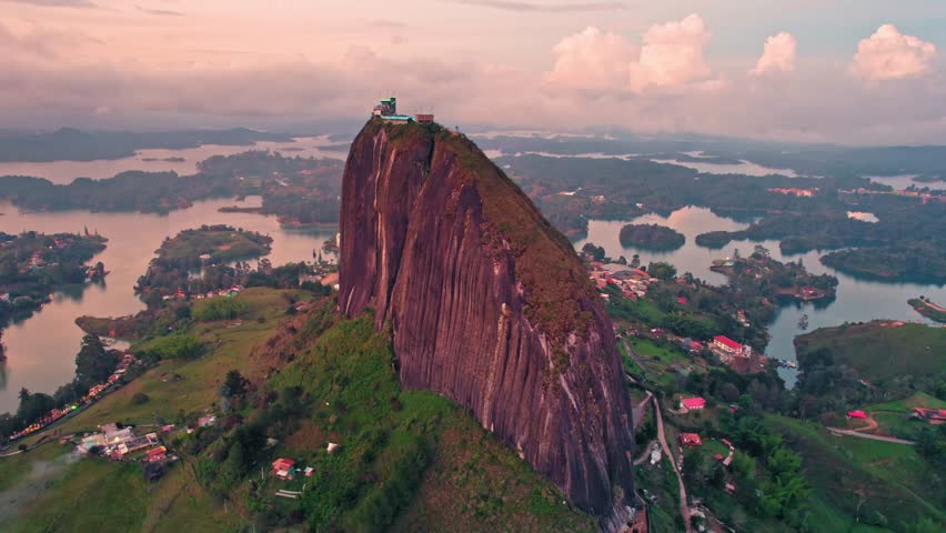 Aerial view of La Piedra del Peñol monolith and lake at sunset – Guatapé, Medellín, Colombia