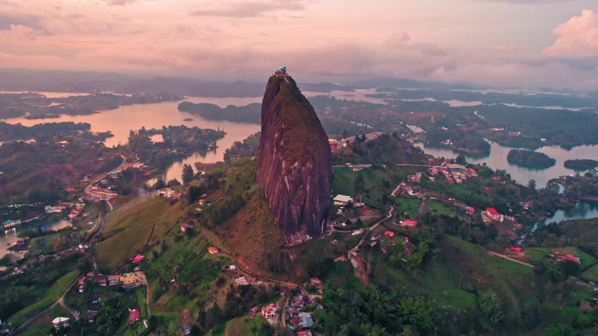 Aerial view of La Piedra del Peñol monolith and lake at sunset – Guatapé, Medellín, Colombia