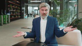 What. Why. Angry Caucasian businessman raising hands in indignant expression, asking reason of failure, demonstrating disbelief irritation by troubles. Bearded guy in suit sitting in office lobby. - Powered by Shutterstock - Get 15% off with code: PIKWIZARD15