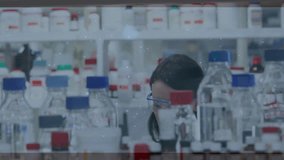 Female scientist reading vial label causing DNA helix and UI appearing, colleague analyzing sample. Laboratory, research, innovation, analytics, biotech, data visualization, collaboration - Powered by Shutterstock - Get 15% off with code: PIKWIZARD15