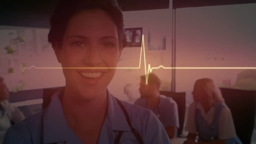 Hospital nurse initiating yellow ECG line scanning face for briefing as colleagues observing. Medical team, collaboration, healthcare, innovation, professional, diagnostic, communication - Powered by Shutterstock - Get 15% off with code: PIKWIZARD15