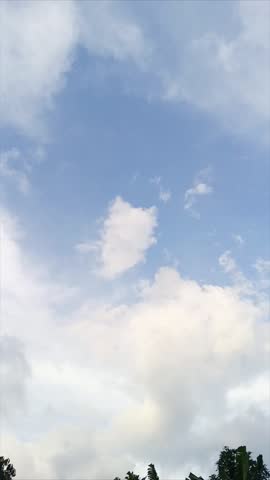 Time lapse of the movement of white clouds in the blue sky shows the beauty of natural patterns