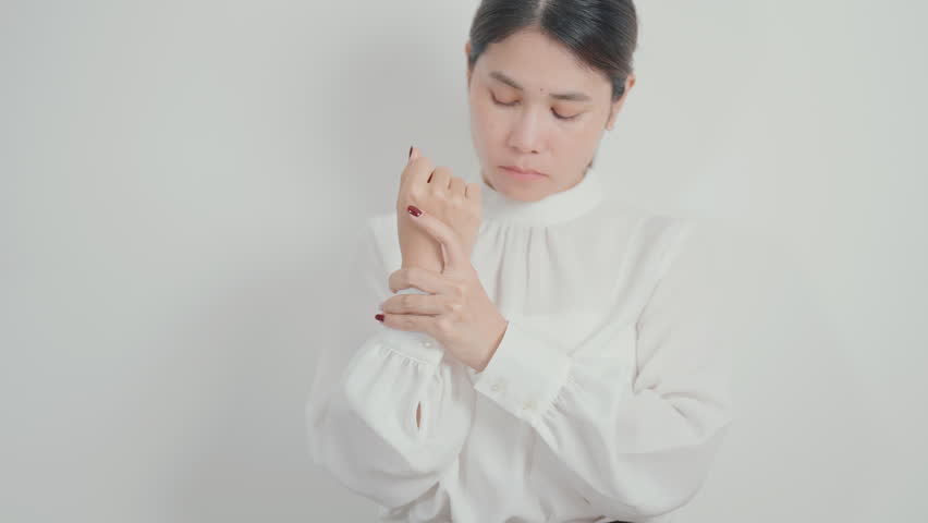Business Woman having wrist pain for Carpal Tunnel Syndrome, Wrist Tendinitis, muscle ache, De Quervain s tenosynovitis, ergonomic, Hand Osteoarthritis, Office syndrome and Parkinson disease concept