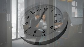 Man and woman reviewing data during business meeting, clock overlay fading in accelerating time. Corporate, teamwork, productivity, analysis, innovation, collaboration, professional - Powered by Shutterstock - Get 15% off with code: PIKWIZARD15