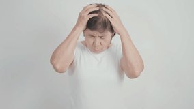 Elderly Woman having headache and Dizzy for concepts of Chronic Stress, Headache and Migraine, World Brain Tumor day, Brain Cancer, Brain Stroke, Dementia, alzheimer, Hypotension and mental health  - Powered by Shutterstock - Get 15% off with code: PIKWIZARD15