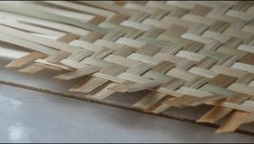 a woman's hands are weaving bamboo. making handicrafts from bamboo - Powered by Shutterstock - Get 15% off with code: PIKWIZARD15