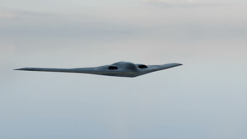 The B-2 Spirit stealth bomber is flying in the sky on a secret mission.