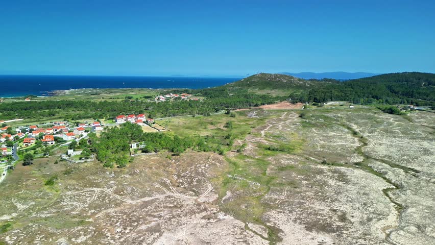Stunning Aerial View showcasing a Coastal Landscape featuring Blue Ocean and Lush Vegetation