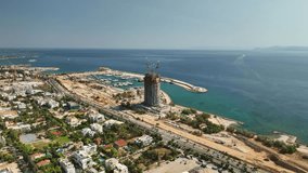 Drone view of massive construction site at former Hellinikon Airport in Athens, Greece. Aerial shot of large-scale urban redevelopment with dusty terrain and exposed infrastructure. - Powered by Shutterstock - Get 15% off with code: PIKWIZARD15