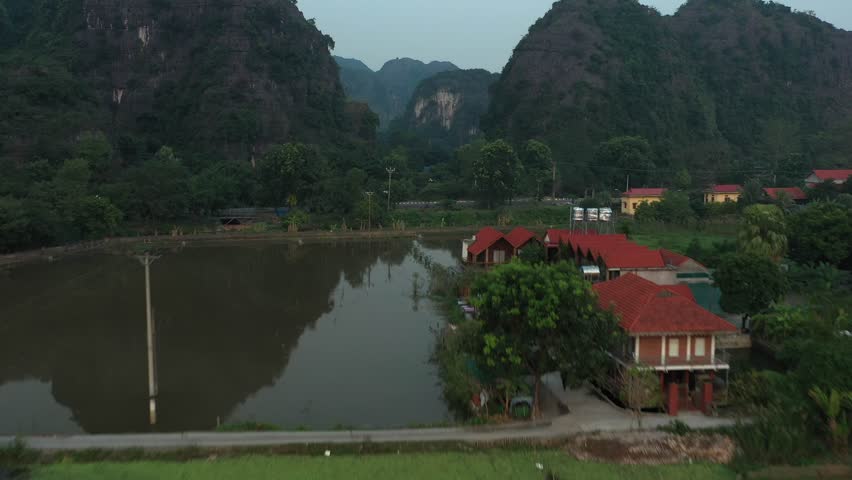 Verdant landscape revealing rocky mountain peaks and winding river valley in Ninh Binh