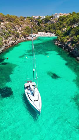Aerial view of the Bay of Cala Pi in Mallorca, Balearic Islands, Spain. Stunning Mediterranean Sea coast with turquoise water sea bay and white sand beach. Mallorca travel destinations