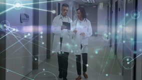Woman pointing tablet and doctor tapping while walking hospital hallway generating network overlay. Medical, collaboration, futuristic, technology, healthcare, professionalism, innovation - Powered by Shutterstock - Get 15% off with code: PIKWIZARD15