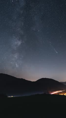 Milky Way Galaxy Stars and Comet Tsuchinshan Atlas Over Countryside Traffic in Summer Night, Vertical Timelapse