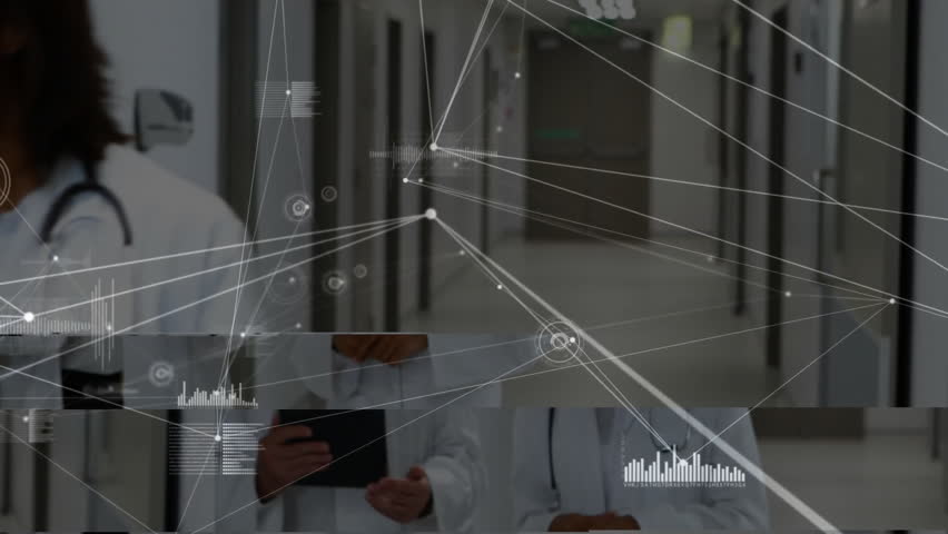 Following female doctor gesture, male colleague tapping tablet reviewing network charts in corridor. Medical, collaboration, technology, digital, healthcare, innovation, professional - Powered by Shutterstock - Get 15% off with code: PIKWIZARD15