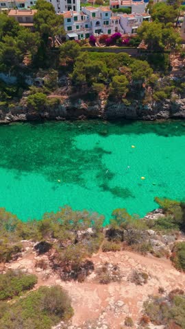 Aerial view of the Bay of Cala Pi in Mallorca, Balearic Islands, Spain. Stunning Mediterranean Sea coast with turquoise water sea bay and white sand beach. Mallorca travel destinations