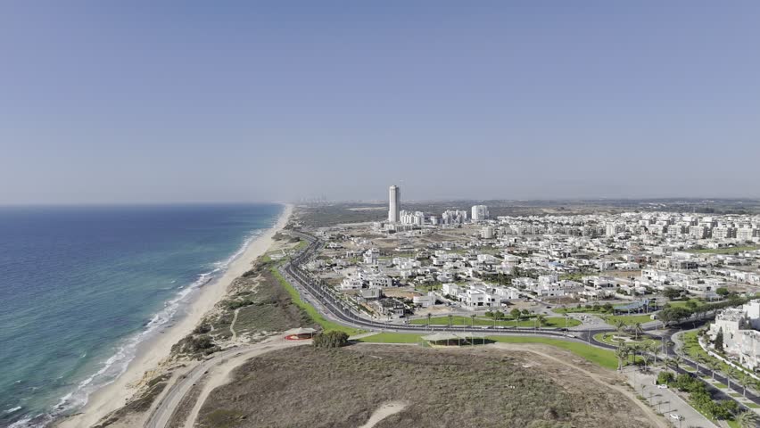 4K aerial footage documenting the coastal highway north of Ashkelon, Israel, with Ashdod city visible in the background

