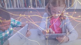 Two students tapping tablets initiating learning, turquoise-shirted boy placing laptop typing. Education, teamwork, technology, collaboration, literacy, innovation, children - Powered by Shutterstock - Get 15% off with code: PIKWIZARD15