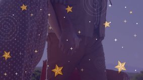 After shifting weight couple walking along shoreline at dusk for travel featuring star overlay. Romantic, couple, beach, sunset, travel, silhouette, twilight - Powered by Shutterstock - Get 15% off with code: PIKWIZARD15