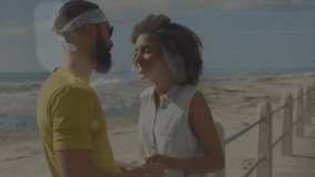 Travel couple touching hands on metal railing beside ocean initiating romantic embrace with waves. Romance, intimacy, connection, leisure, scenic, tranquility, joy - Powered by Shutterstock - Get 15% off with code: PIKWIZARD15