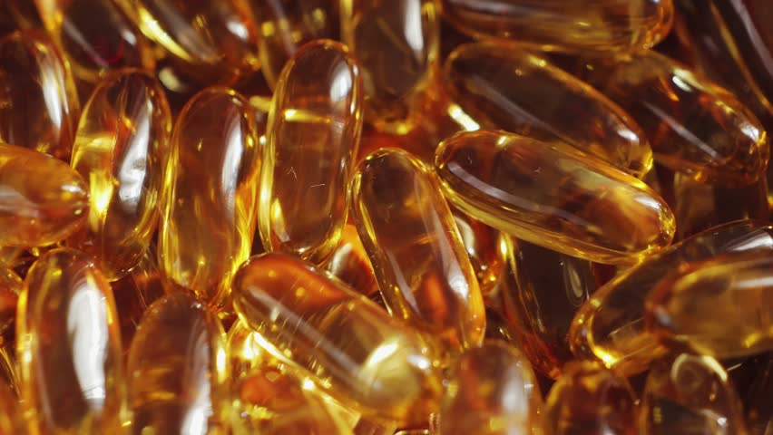 Capsules of omega 3 fish oil close up footage. Vitamins. Natural supplement close-up. Healthy lifestyle concept. High quality 4k footage