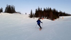 Telemark downhill skier skiing Hafjell Alpine ski resort Øyer mountain Norway Norge arctic sunset golden hour last run Olympic torch man Lillehammer clear skies groomed trail runs icy packed follow - Powered by Shutterstock - Get 15% off with code: PIKWIZARD15