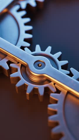 Looping animation of a mechanical structure made of metal gears. Cyclic movement. Close-up. Vertical composition. Defocus.