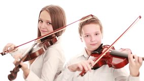 Two teenager playing the violin, studio shot