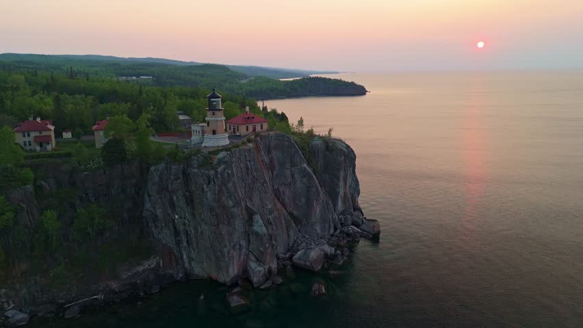 Breathtaking sunrise illuminating the historic Split Rock Lighthouse on Lake Superior