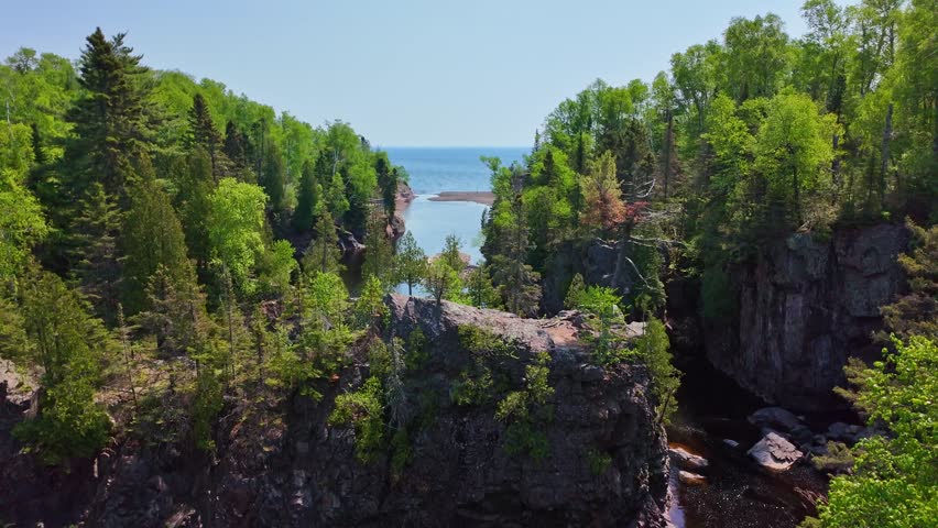 Views of High Falls, the tallest waterfall entirely within Minnesota, located in Tettegouche State Park along the Baptism River