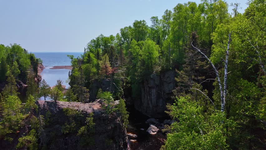 Views of High Falls, the tallest waterfall entirely within Minnesota, located in Tettegouche State Park along the Baptism River
