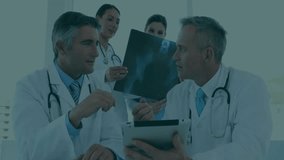Doctor tapping tablet and explaining Xray while merging binary records for analysis. Medical team, digital health, collaboration, clinical analysis, healthcare technology, professional consultation, - Powered by Shutterstock - Get 15% off with code: PIKWIZARD15