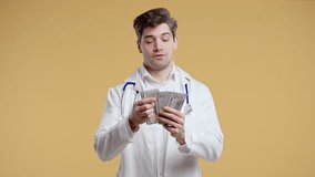 Rich Doctor Man Counting Usd Money. Handsome Medical Health Care Worker, Dollars - Powered by Shutterstock - Get 15% off with code: PIKWIZARD15
