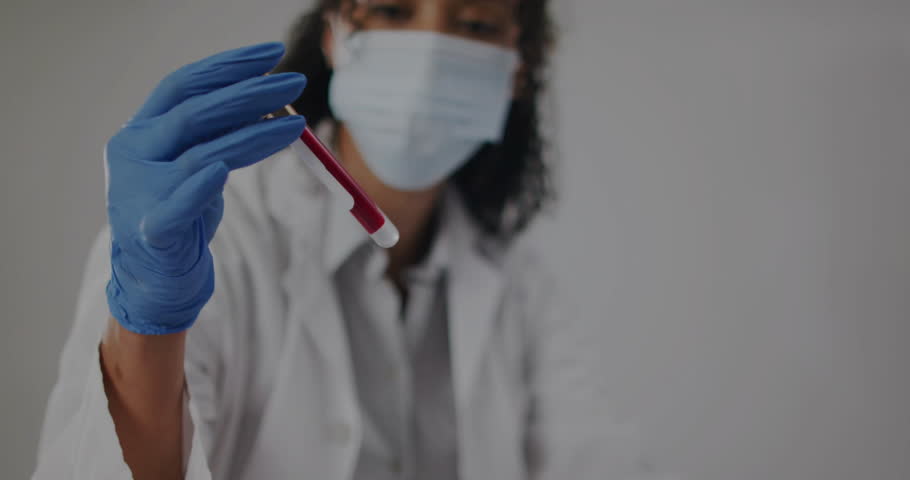 Lab technician lifting blood tube, animating DNA-helix, placing tube in rack, entering testing data. Scientist, biology, analysis, research, innovation, technology, healthcare