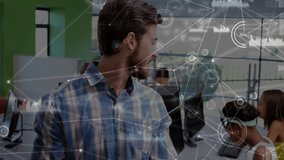 Man tapping tablet and showing data overlay in tech lab for monitoring students typing and smiling. Technology, education, mentorship, connectivity, digital, innovation, learning - Powered by Shutterstock - Get 15% off with code: PIKWIZARD15