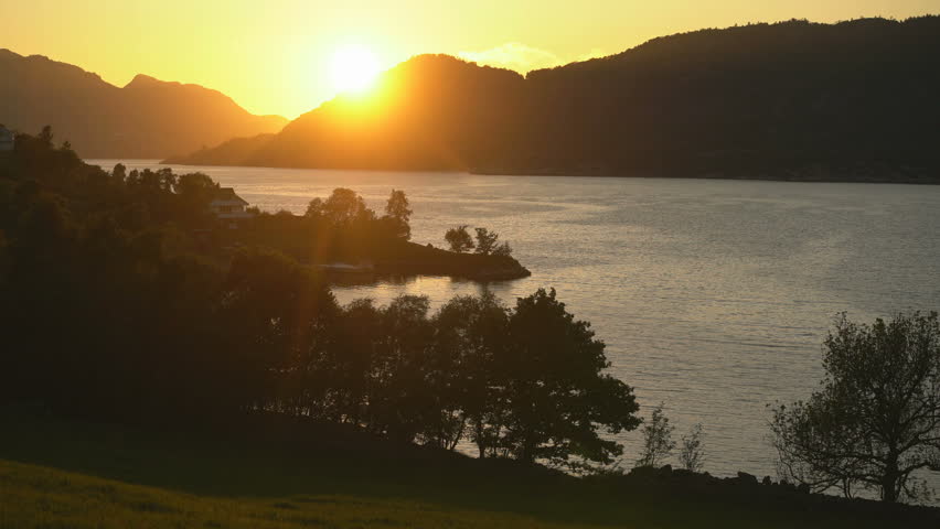 Sunset over Lysefjord, Norway – Tranquil Fjord Landscape in Golden Light