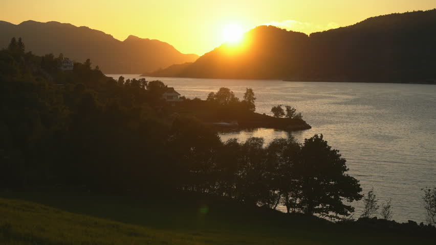 Sunset over Lysefjord, Norway – Tranquil Fjord Landscape in Golden Light
