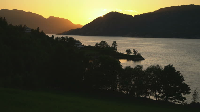 Sunset over Lysefjord, Norway – Tranquil Fjord Landscape in Golden Light