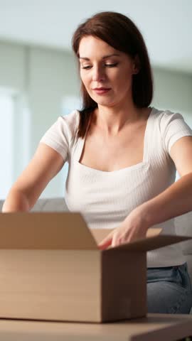 Cosmetic Gift Box Delivery. Woman Opening Received Parcel
