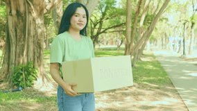 ]Female volunteers hold cardboard boxes in a community park to collect donations to help victims of natural disasters, wars, and the homeless. They enjoy volunteering with a cheerful look. - Powered by Shutterstock - Get 15% off with code: PIKWIZARD15