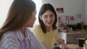 Side view shot of two teenage girls studying together and chatting while eating snacks in dorm room - Powered by Shutterstock - Get 15% off with code: PIKWIZARD15