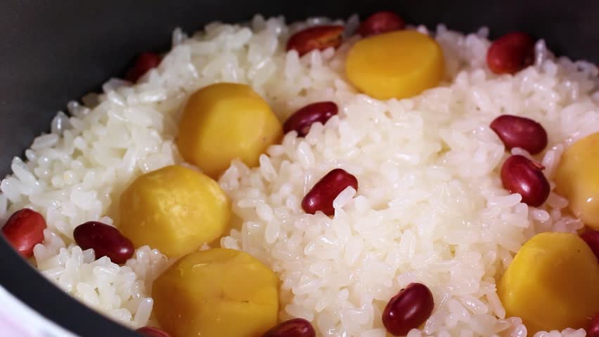 Freshly cooked Chestnut rice close up, rotating