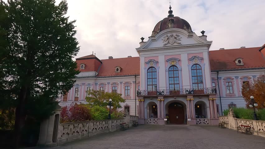 Stunning morning view of Royal Palace of Godollo. Beautiful autumn scene of Godollo - city in Pest County, Budapest metropolitan area, Hungary, Europe. 4K video (Ultra High Definition).