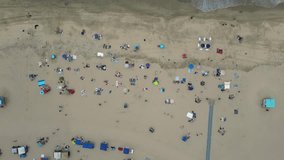 Drone flies up over Huntington Beach pier on the 4th of July in 60fps - Powered by Shutterstock - Get 15% off with code: PIKWIZARD15