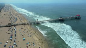 Static 60fps Drone shot of Huntington Beach crowd on the 4th of July - Powered by Shutterstock - Get 15% off with code: PIKWIZARD15