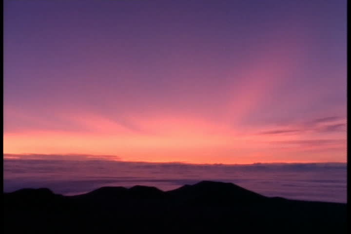 KAMUELA, HAWAII - CIRCA JULY 1991: Streaky sunlight appears on the horizon on day of total eclipse.