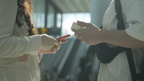 Two people are talking on their cell phones in a public place. One of them is holding a red phone - Powered by Shutterstock - Get 15% off with code: PIKWIZARD15