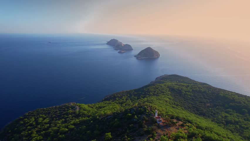 Gelidonya lighthouse Lycian Way in Antalya, Turkey Aerial top view. Concept beautiful summer landscape at sunset from drone.